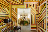 <p>Nathan Green was commissioned to create the mural, "CEPRD Retrofit (For Ken and Sam)" in the hallway of the Cedar Creek lake house&nbsp;of Neiman Marcus executive Ken Downing and his partner, real estate agent, Sam Saladino. &nbsp;The piece took&nbsp;nearly 190 hours to complete.&nbsp;"There is nothing more irreverent," Downing says, "than&nbsp;having an artist create something right on the drywall. Every&nbsp;time I walk through the hallway, it just makes me smile." (Stephen Karlisch/Special Contributor)&nbsp;</p>
