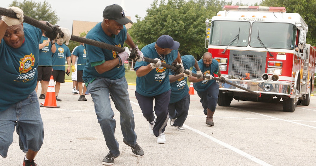 Watch: Teams of 12 pull 55,000-pound fire truck, all for charity