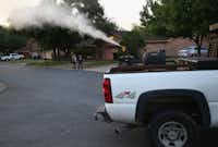 <p>Currently, counties around Texas, including Dallas County, use ground spraying of insecticides to control mosquito populations and protect against mosquito-borne diseases like Zika and West Nile virus. Here, a neighborhood in McAllen is sprayed for mosquitoes early on April 14, 2016.</p>(John Moore/Getty Images)
