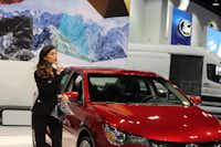 Isabelle Du, a Production Plus employee, talks about a Toyota at the Denver Auto Show in April, 2017.(Courtesy of Production Plus - The Talent Shop)