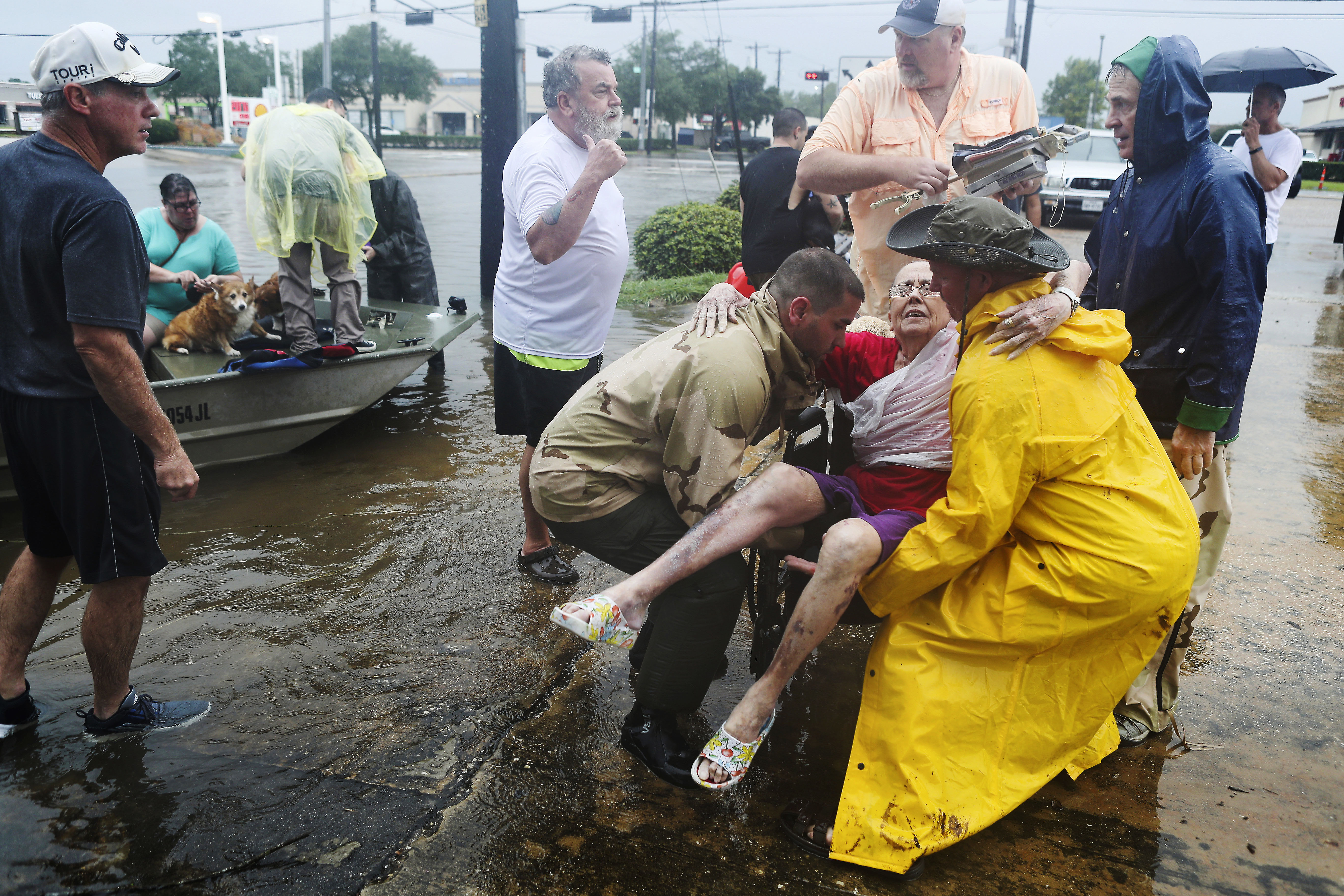 Neighbors used their own boats Sunday to rescue Jane Rhodes in the Friendswood area of Houston. Hurricane Harvey made landfall in Texas on Friday night as the strongest hurricane to hit the U.S. in more than a decade.&nbsp;(Steve Gonzales/Houston Chronicle)