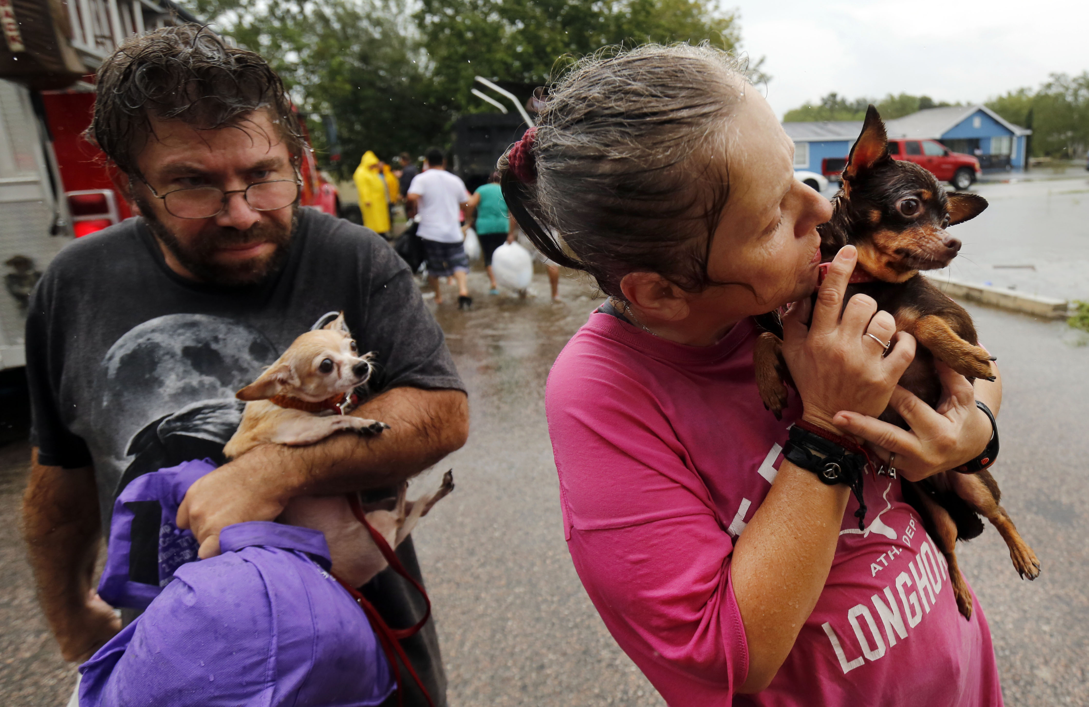 Letha McCraney was grateful that she and her dog, Coco, were rescued from their flooded home Sunday in Pearland Acres Mobile Home Community in Pearland. She was joined by her brother, Steven Barnes, and his dog, Peanut.&nbsp;(Tom Fox/Staff Photographer)