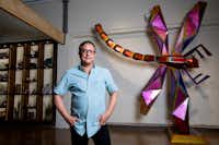Jorge Baldor, founder of Mercado Artesanal, in front of<i> Libelula,</i> a sculpture by Oaxacan artist Fernando Andriacci. Baldor, who was born in Cuba but raised in Oak Cliff, opened the gallery to provide a unique cultural experience by featuring handcrafted works from Latin America.&nbsp;(Jeffrey McWhorter/Special Contributor)