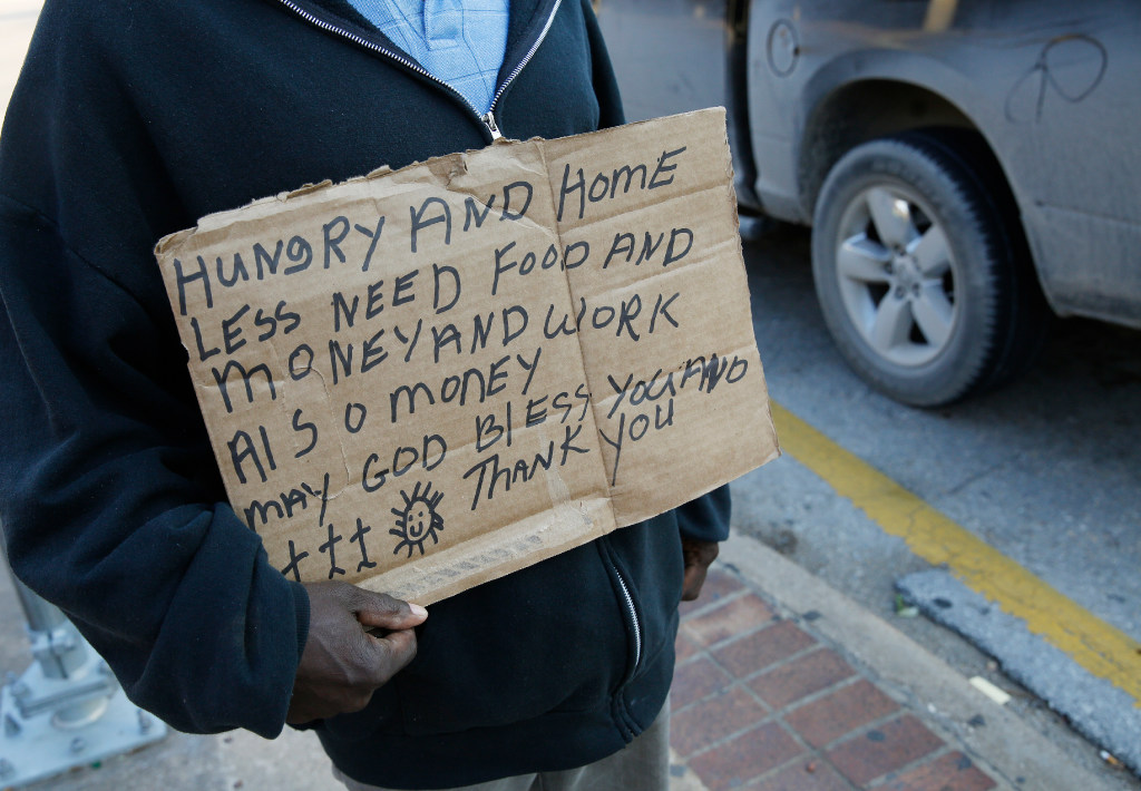 Signs ask drivers give to charity, not panhandlers