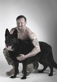 Ryan Henderson, 37, poses with his emotional support dog, Satan. Henderson and Satan served together in the Army as an explosive-detection team. When Henderson was injured, he and Satan were separated, but they were reunited five years later.(Carrie Caposello/Carrie Caposello Photography)