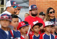 Danny Latin, Ray Garcia, and Jimmy Villatoro of El Paso listen during the candlelight vigil at The Sportspark in El Paso, Texas on Sunday, August 4, 2019. (Vernon Bryant/Staff Photographer)
