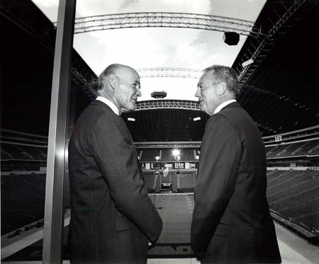 Fans in the suites cheer the unveiling of Ring of Honor honoree Tom Landry  during the halftime ceremony as the Dallas Cowboys faced the New York  Giants at Cowboys Stadium in Arlington